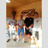 Men lined up in cabin