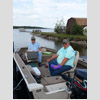 Two men in boat waiting to fish